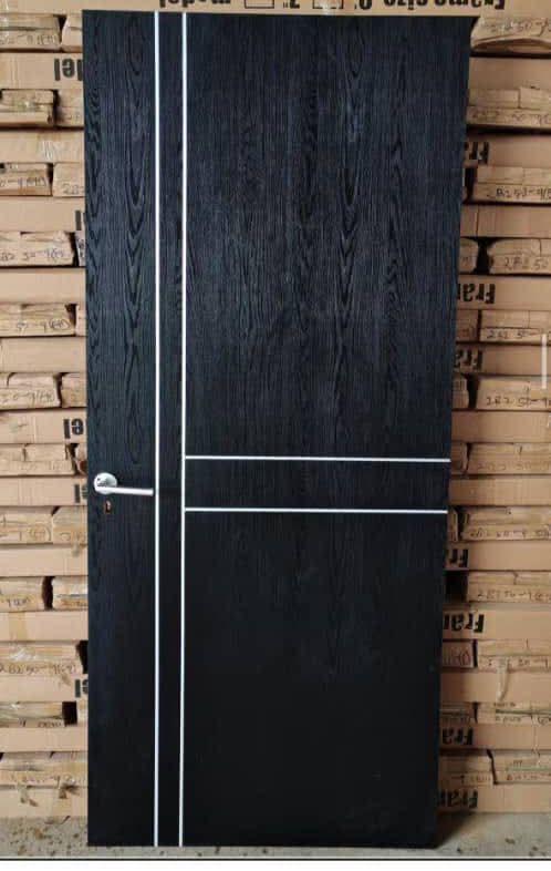 Foreign wooden door with archtried frame